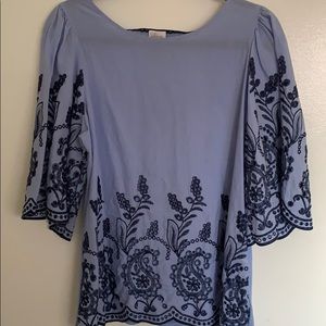 Blue top with floral stitching